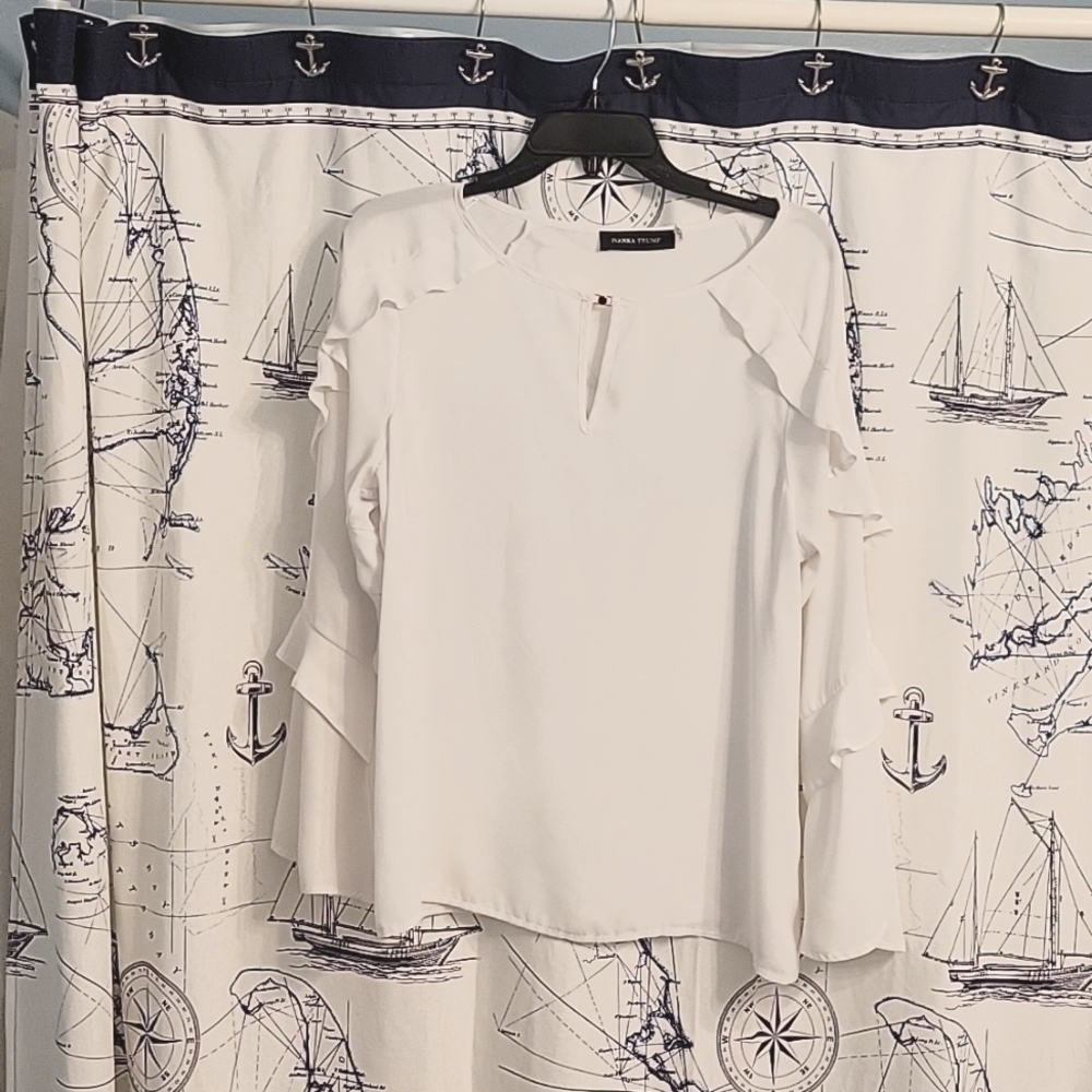 White ruffle blouse
